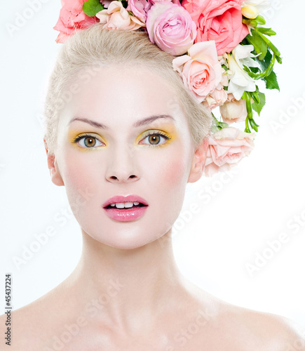 Photo: beautiful blonde with flowers in her hair beautiful blonde with flowers in her hair
