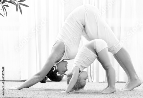 Photo: Mother and daughter doind exercise Mother and daughter doind exercise