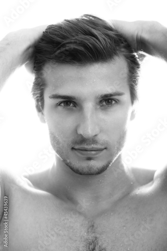 Photo: Young and handsome guy with water drops on his face Young and handsome guy with water drops on his face