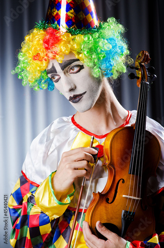 Photo: Clown playing on the violin Clown playing on the violin