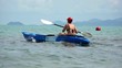 Woman kayaking at tropical sea