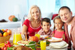Family by festive table