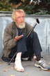 Man gives alms to a beggar