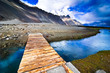 Mountain landscape view with river and wooden bridge