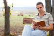 Man enjoying a book in the garden