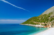 Beautiful sunny beach with white sand and blue water