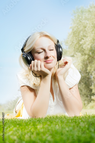 Photo: happiness smiling blonde woman relaxing happiness smiling blonde woman relaxing