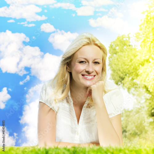 Photo: happiness smiling blonde woman relaxing happiness smiling blonde woman relaxing