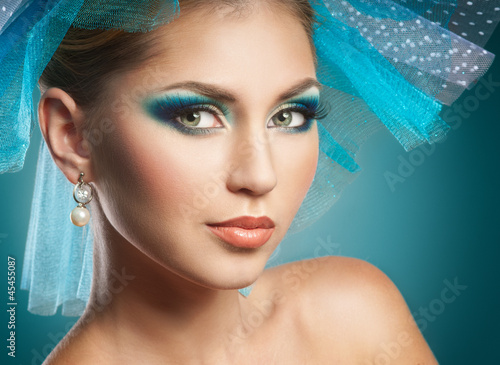 Photo: Beautiful woman with bright blue make-up Beautiful woman with bright blue make-up