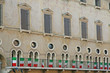 medieval palace with Italian tricolor flags in vicenza in italy