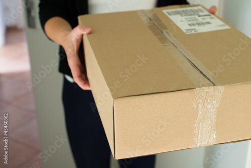 Photo: Woman receiving parcel Woman receiving parcel