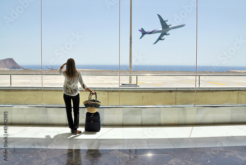 Photo: Girl at the airport window Girl at the airport window