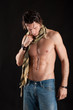 Portrait of confident young man shirtless with jeans 