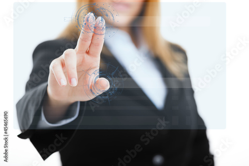 Photo: Woman using a touchscreen Woman using a touchscreen