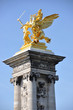 Golden statue on the bridge of Alexandre III in Paris
