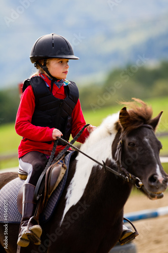 Photo: Horse riding - lovely equestrian is riding on a horse Horse riding - lovely equestrian is riding on a horse