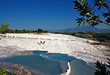 Travetine covered hills and rock pools of Pamukkale Turkey