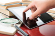 Hand touching a touchscreen tablet pc