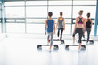 Four women stepping on boards