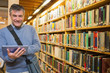 Man smiling while holding tablet pc