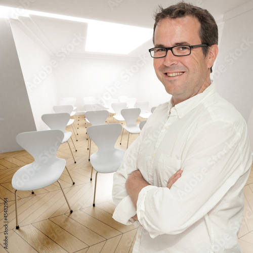 Photo: Smiling man in conference room Smiling man in conference room