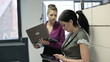 Video: Businesswomen working with tablet computer and laptop in office Businesswomen working with tablet computer and laptop in office