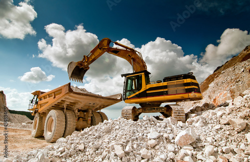 Photo: bulldozer excavator in quarry bulldozer excavator in quarry