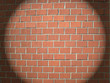 Light spot on a brick wall