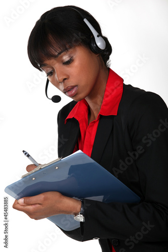 Photo: Call-center worker with clipboard Call-center worker with clipboard