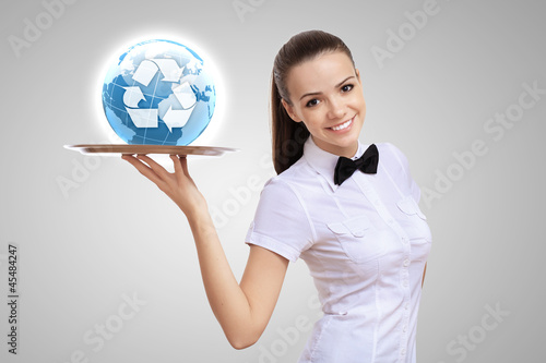 Photo: Waitress with a tray with green symbol on it Waitress with a tray with green symbol on it
