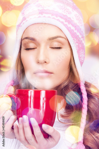 Photo: beautiful woman with red mug beautiful woman with red mug