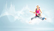 Photo: young woman playing on electro guitar and jumping young woman playing on electro guitar and jumping