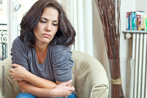 Photo: Young woman looking sad Young woman looking sad