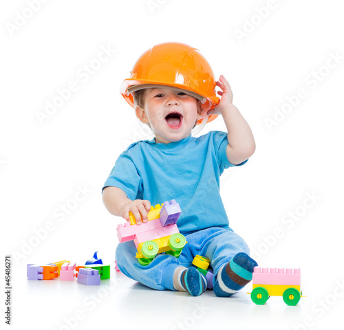 Photo: kid playing with building blocks toy kid playing with building blocks toy
