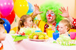happy kids with clown on birthday party