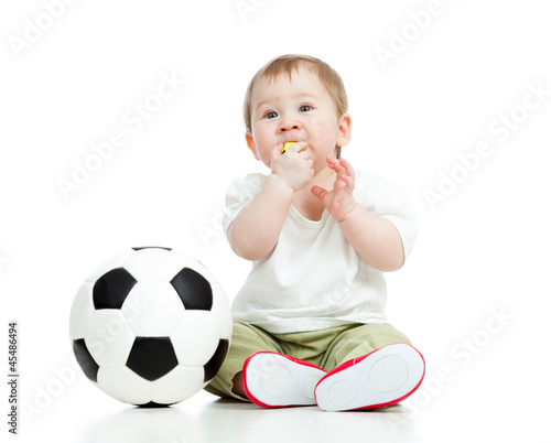 Photo: adorable baby football player with ball and whistle over white b adorable baby football player with ball and whistle over white b