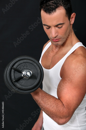 Photo: man lifting weight man lifting weight