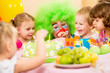 kids celebrating birthday party with clown