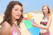 Two teenage girls at the beach