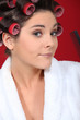 Young woman wearing hair curlers