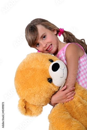 Photo: Little girl with toy bear Little girl with toy bear