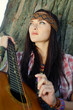 Beautiful hippie girl with guitar