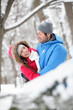 Romantic couple hugging in the snow