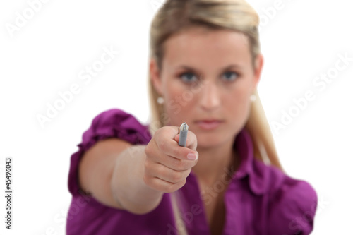 Photo: Woman pointing her pen at you Woman pointing her pen at you