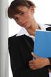 Serious businesswoman with file