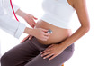 Beautiful pregnant woman with doctor and stethoscope