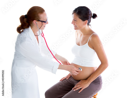 Photo: Beautiful pregnant woman with doctor and stethoscope Beautiful pregnant woman with doctor and stethoscope