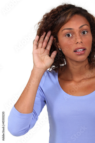 Photo: Woman straining to hear Woman straining to hear