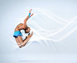 Young woman in gymnast suit posing