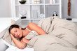 Woman asleep in bed